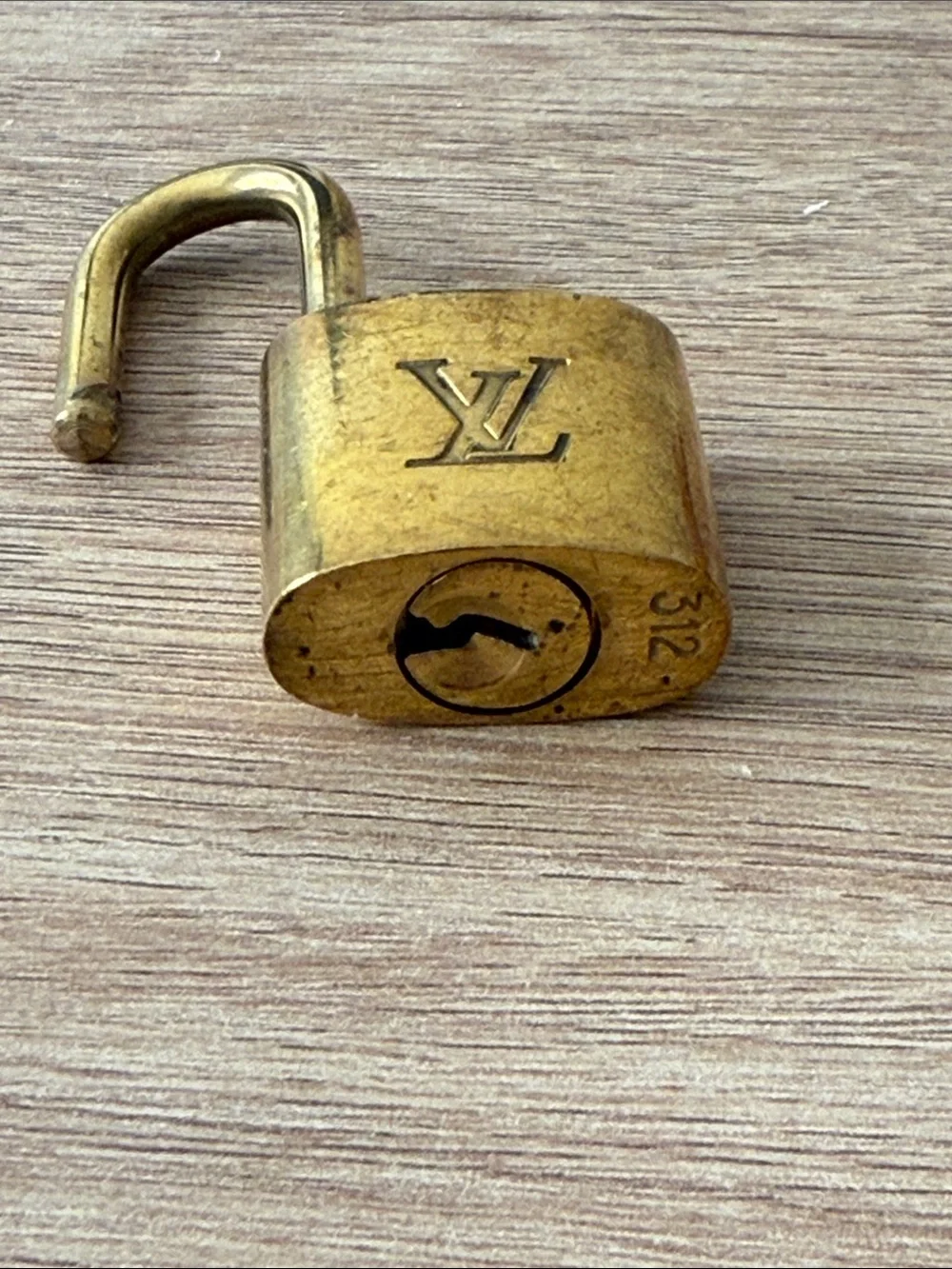 Louis Vuitton compact gold